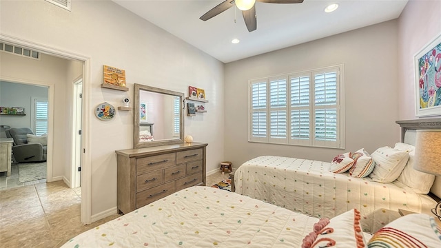 tiled bedroom with ceiling fan