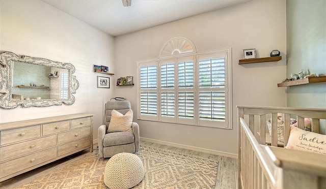 bedroom with ceiling fan and light wood-type flooring