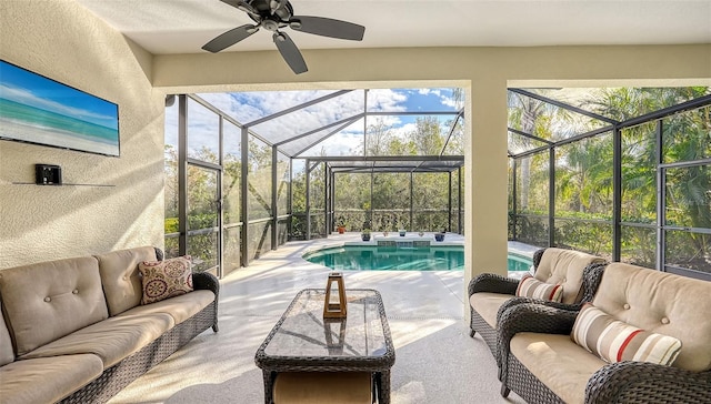 sunroom / solarium featuring a wealth of natural light and ceiling fan