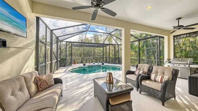 sunroom featuring ceiling fan