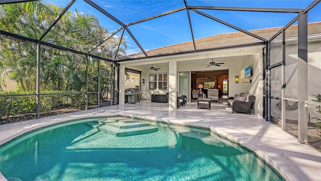 view of swimming pool with a patio, outdoor lounge area, a lanai, and ceiling fan