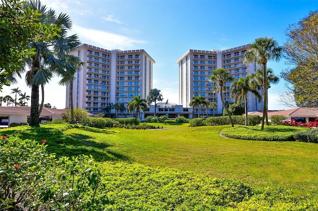 view of home's community with a yard