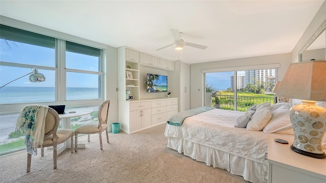 bedroom featuring access to exterior, ceiling fan, and light colored carpet