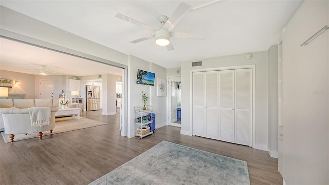 entryway with hardwood / wood-style flooring and ceiling fan