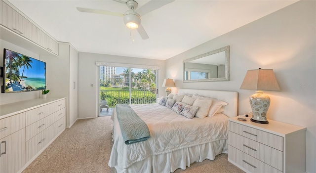 bedroom with light carpet, ceiling fan, and access to exterior