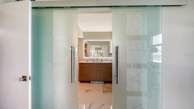 bathroom with vanity and tile patterned flooring