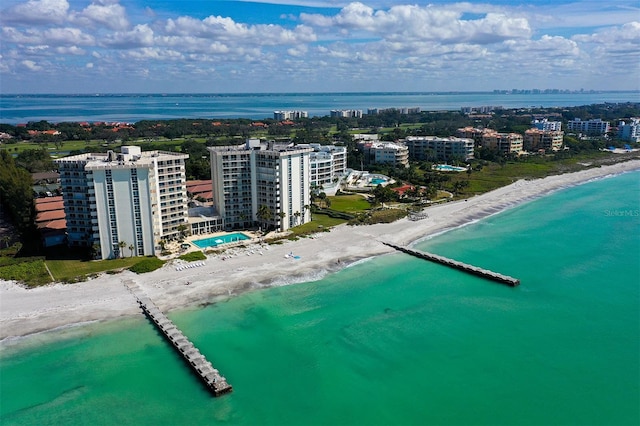 drone / aerial view featuring a view of the beach and a water view