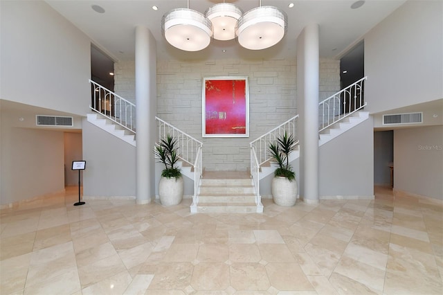 interior space featuring a towering ceiling