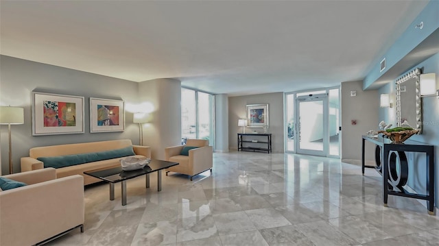 tiled living room featuring expansive windows