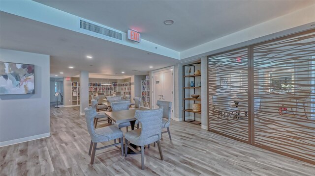 dining area featuring light wood-type flooring