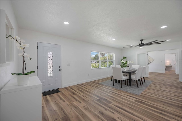 foyer featuring a textured ceiling, ceiling fan, and hardwood / wood-style floors