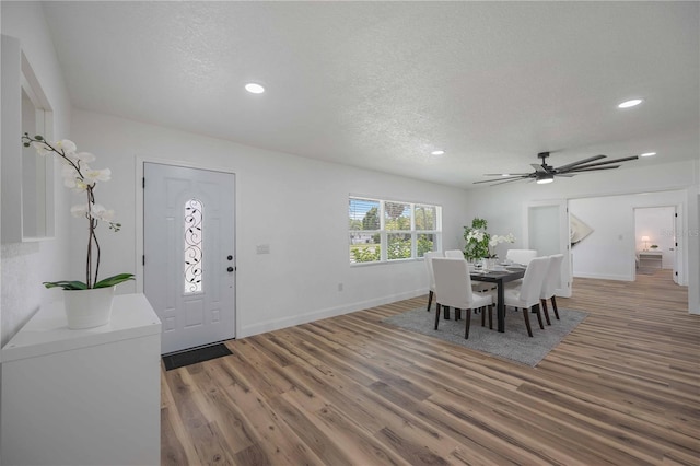 353 Suwanee Ave, Sarasota, FL 34243 - dining room featuring a ceiling fan, baseboards, light wood finished floors, and a textured ceiling