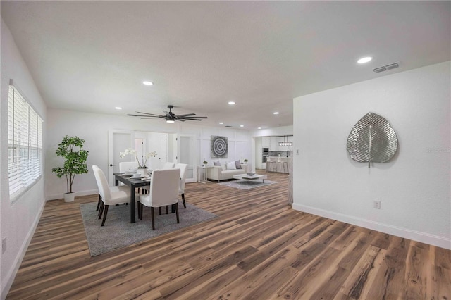 dining room with ceiling fan and hardwood / wood-style floors