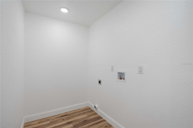 353 Suwanee Ave, Sarasota, FL 34243 - laundry area with hookup for an electric dryer, laundry area, baseboards, light wood-style floors, and hookup for a washing machine