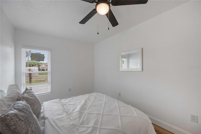 353 Suwanee Ave, Sarasota, FL 34243 - bedroom with wood finished floors, baseboards, and ceiling fan