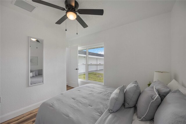 bedroom featuring wood-type flooring and ceiling fan