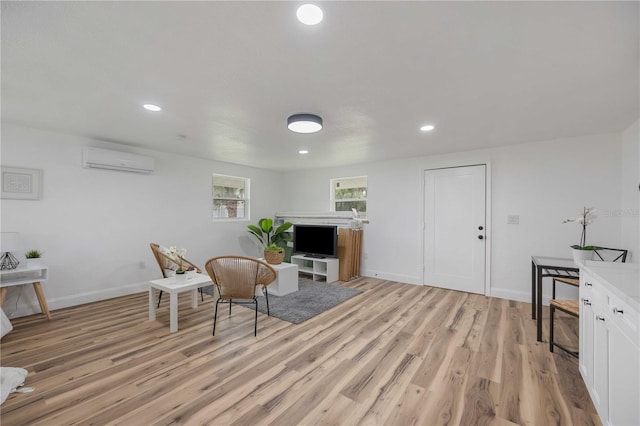 353 Suwanee Ave, Sarasota, FL 34243 - sitting room with baseboards, a wall mounted AC, recessed lighting, and light wood-type flooring