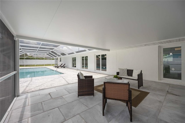 view of patio with an outdoor hangout area and a lanai