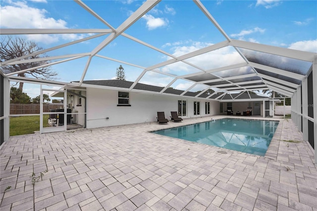 view of pool featuring a lanai and a patio