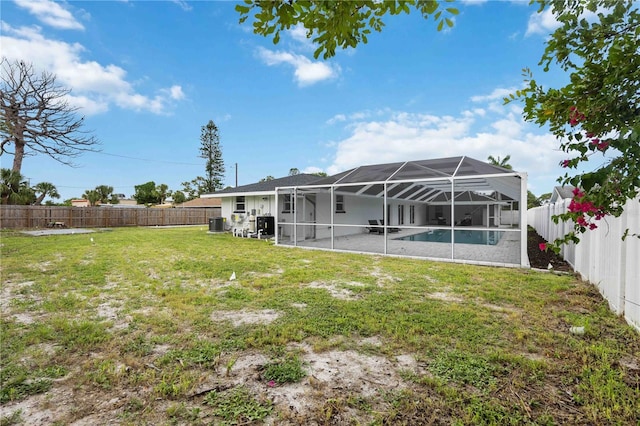353 Suwanee Ave, Sarasota, FL 34243 - view of yard featuring cooling unit, a fenced backyard, and a lanai