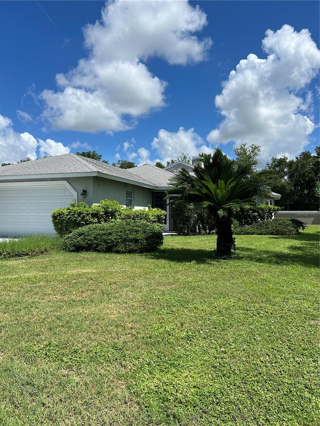 view of yard with a garage