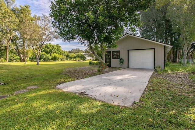 ranch-style home featuring a garage, an outdoor structure, and a front lawn