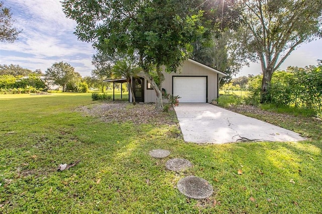 view of front facade featuring a garage, an outdoor structure, and a front yard