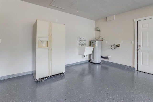 garage featuring electric water heater, sink, and white fridge with ice dispenser