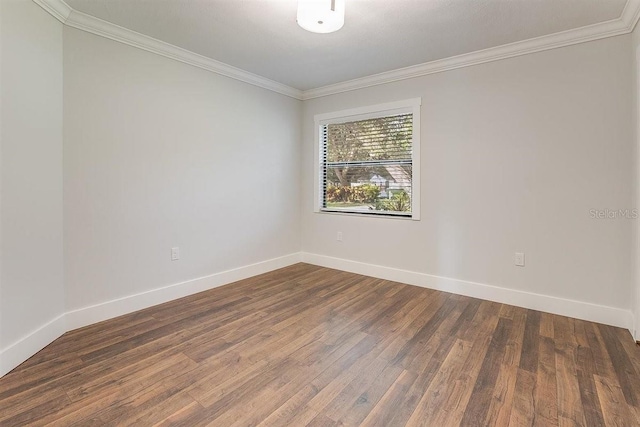 unfurnished room with crown molding and dark wood-type flooring