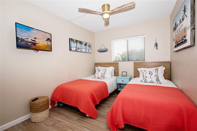 bedroom featuring ceiling fan and wood-type flooring