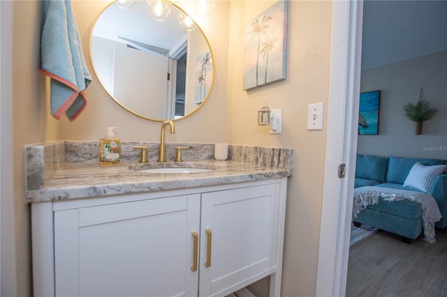 bathroom featuring vanity and hardwood / wood-style flooring