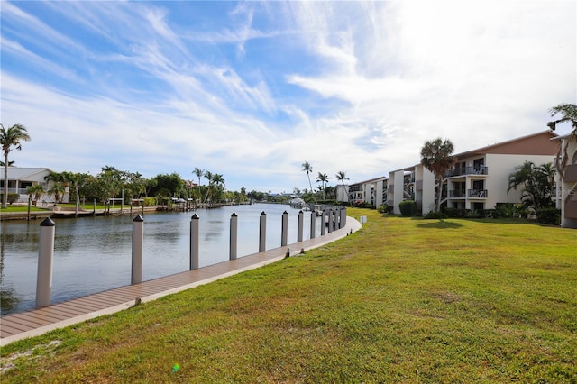 dock area featuring a yard and a water view