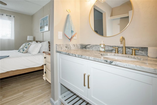 bathroom with vanity and hardwood / wood-style flooring