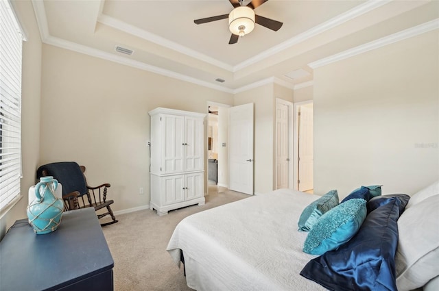 bedroom featuring light colored carpet, a raised ceiling, crown molding, and ceiling fan