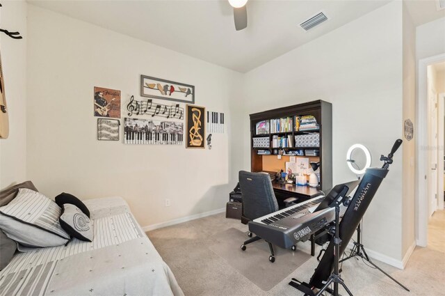 bedroom featuring light carpet and ceiling fan