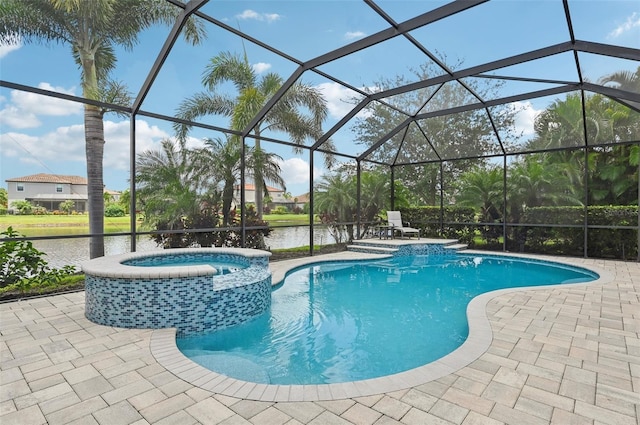 view of swimming pool featuring an in ground hot tub, a lanai, and a patio area