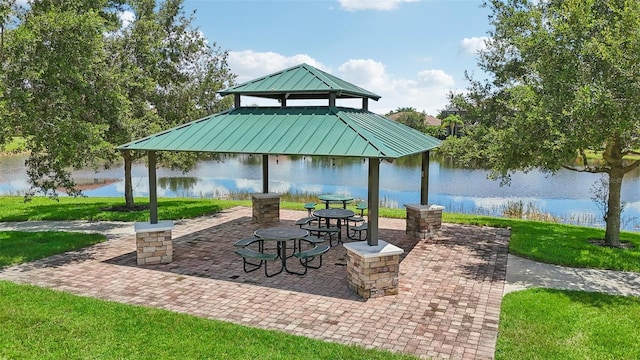 view of patio featuring a water view