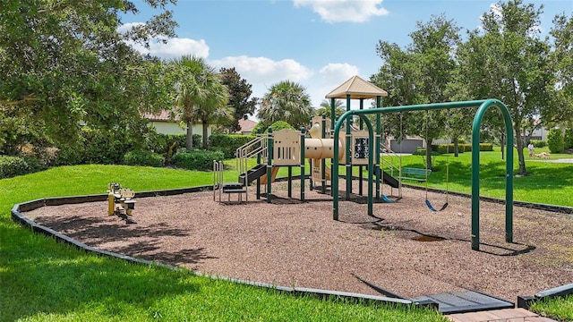 view of jungle gym with a lawn