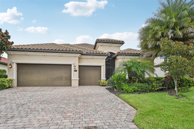 13215 Ramblewood Trl, Bradenton, FL 34211 - mediterranean / spanish home with stucco siding, a tiled roof, decorative driveway, and an attached garage