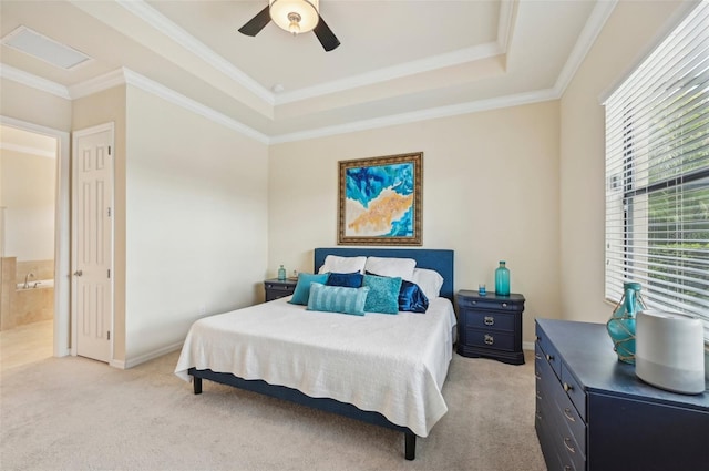 13215 Ramblewood Trl, Bradenton, FL 34211 - bedroom featuring baseboards, ornamental molding, light carpet, ensuite bath, and a tray ceiling