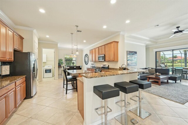 13215 Ramblewood Trl, Bradenton, FL 34211 - kitchen featuring a wealth of natural light, appliances with stainless steel finishes, stone countertops, and recessed lighting