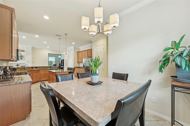 13215 Ramblewood Trl, Bradenton, FL 34211 - dining area with crown molding, recessed lighting, a chandelier, and light tile patterned flooring