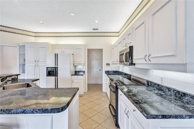 kitchen with white cabinetry, sink, white refrigerator with ice dispenser, black electric range, and a textured ceiling