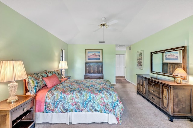 bedroom featuring light colored carpet and ceiling fan