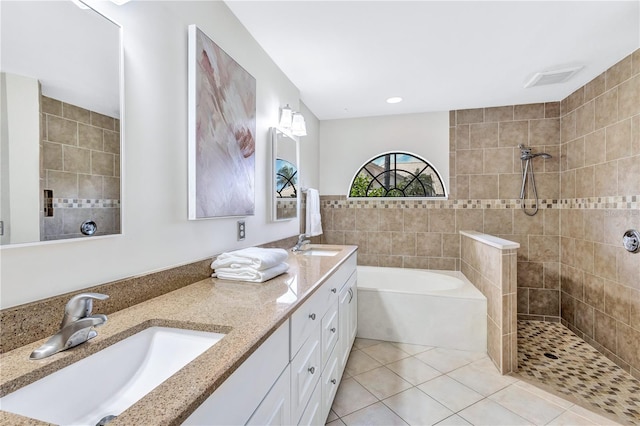 bathroom with vanity, tile patterned floors, and separate shower and tub