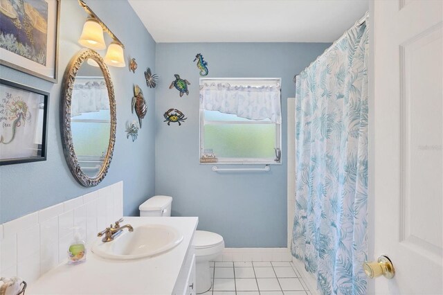 bathroom with tile patterned floors, toilet, and vanity