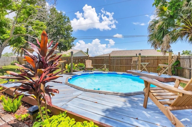 view of pool with a wooden deck