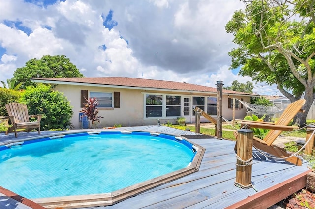 view of pool featuring a wooden deck