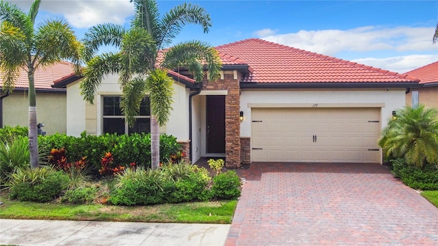 mediterranean / spanish-style home featuring a garage