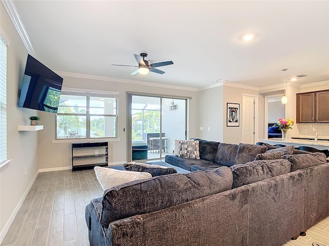 living room with ceiling fan, light hardwood / wood-style flooring, and ornamental molding